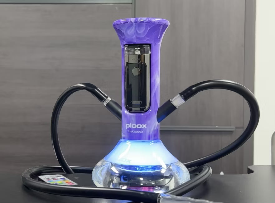 Ploox Hookah Nest Vape with a hose on a reflective surface